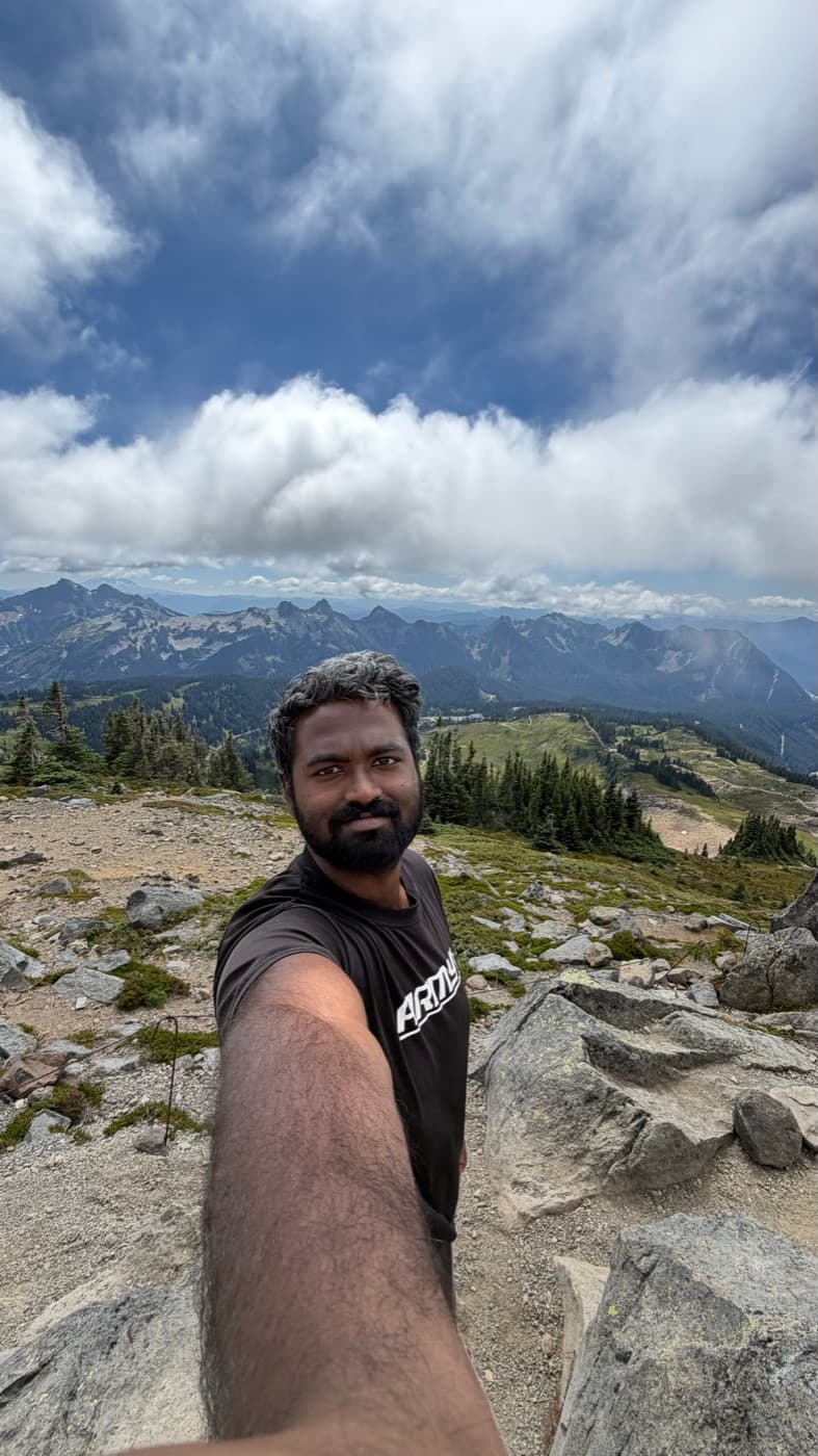 At a mountain summit part-way through a hike
